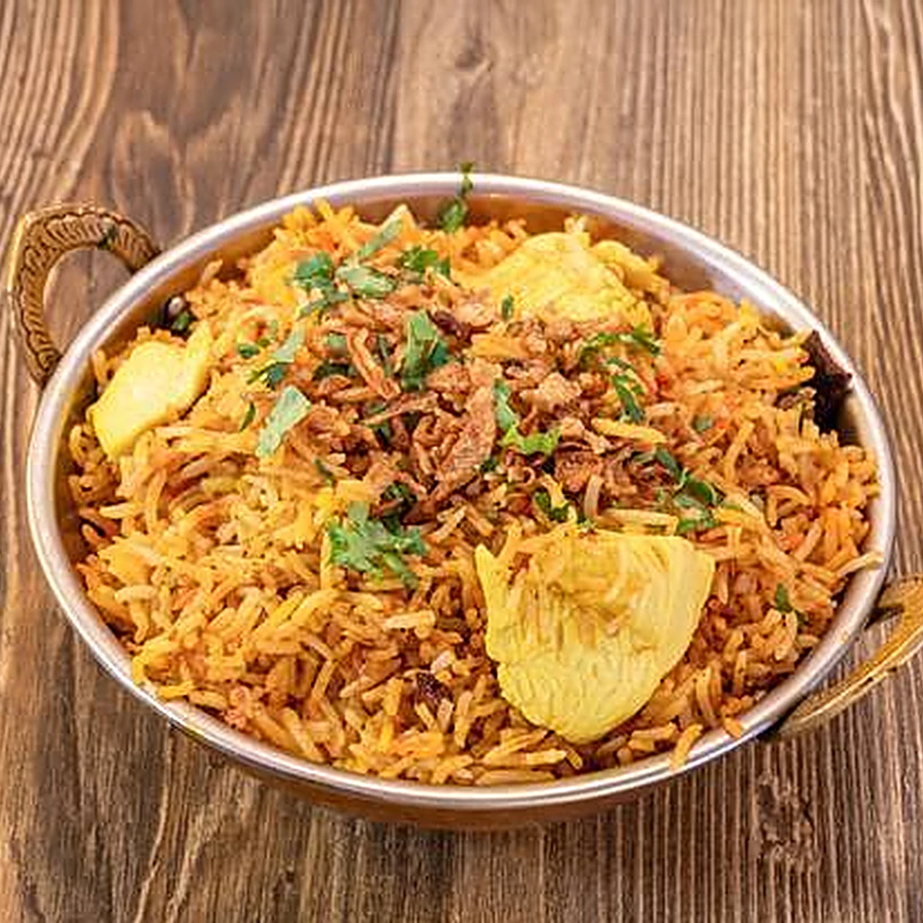 Chicken biryani at Saffron Canmore - basmati rice slow-cooked dum style with spiced chicken