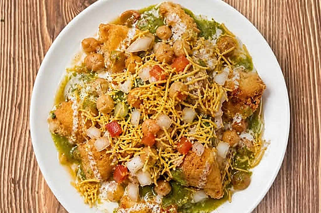 Samosa chana chaat at Saffron Canmore - crisp samosas topped with spiced chickpeas and chutneys