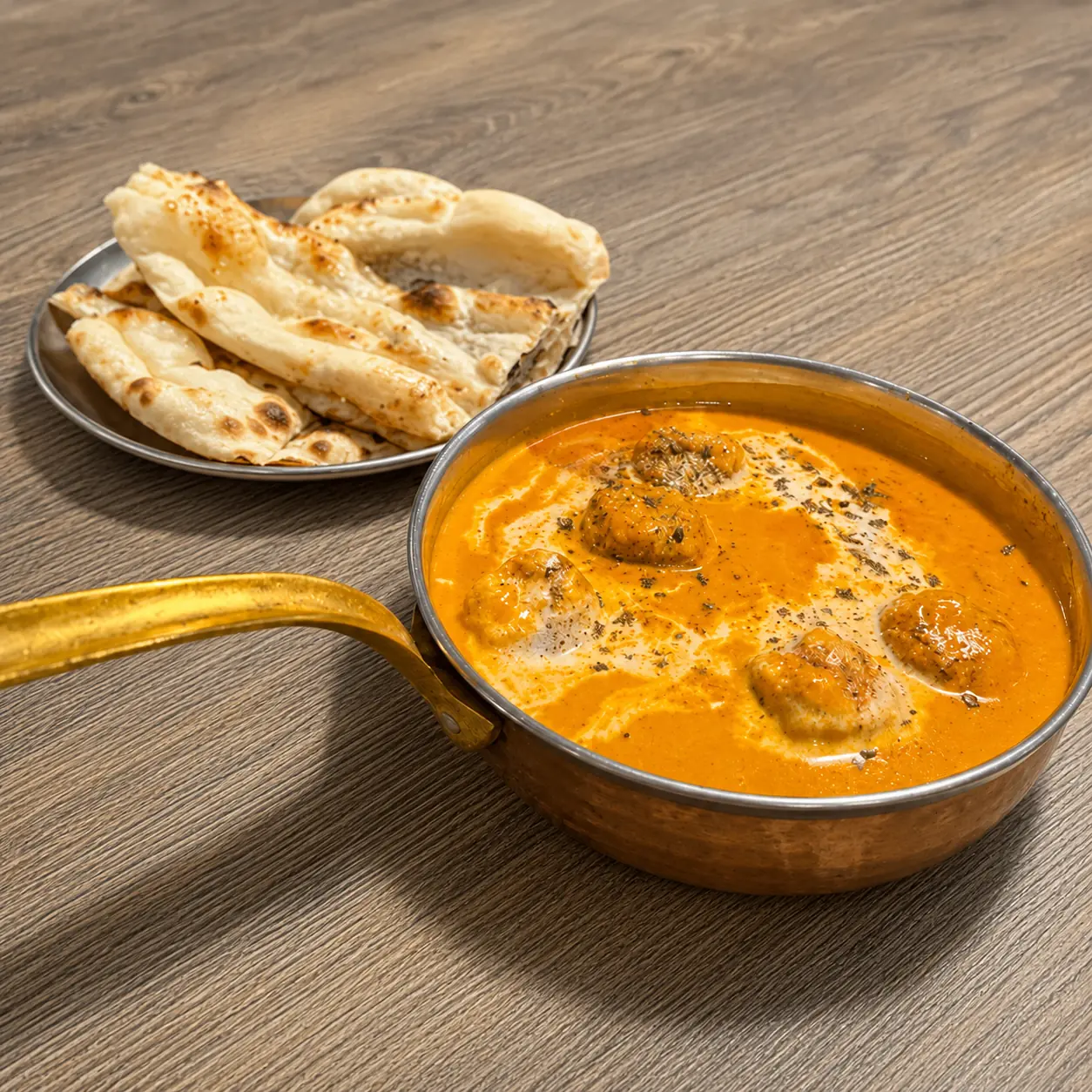 Butter chicken at Saffron – rich creamy tomato curry served in Canmore, Banff and Lake Louise