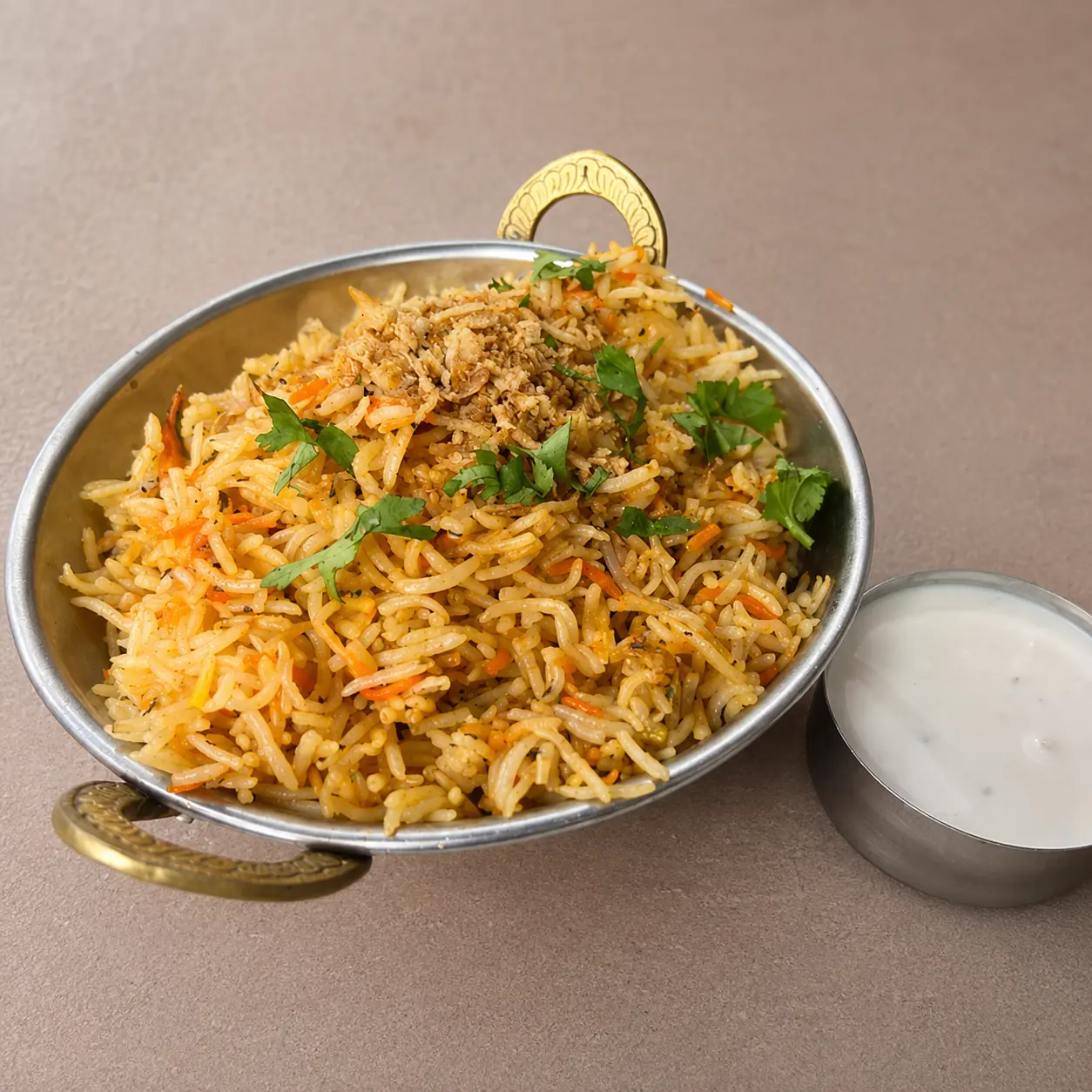 Chicken biryani at Saffron Canmore – fragrant dum-cooked basmati rice layered with spiced chicken